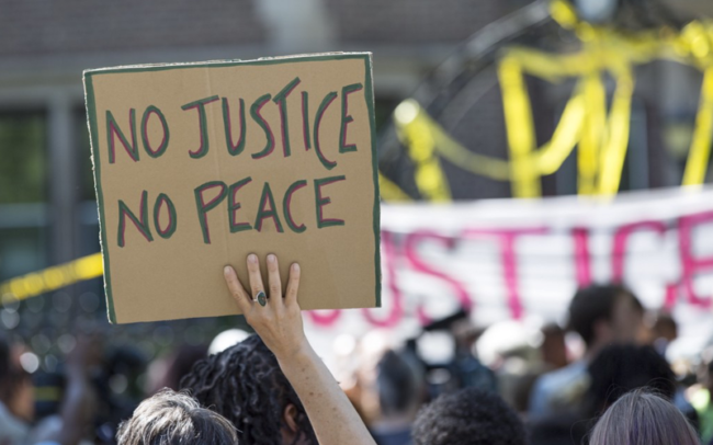 No justice, no peace. Know justice, know peace. No justice, no peace. Know justice, know peace. NME